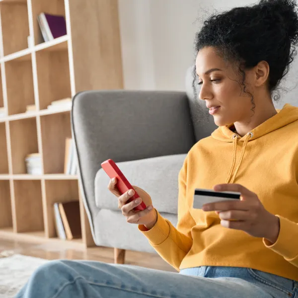 Woman making payment using digital banking features.